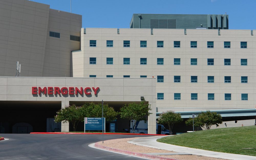 Hospital building with its emergency entrance and ambulance bay
